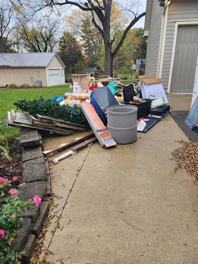 Dumpster being loaded with debris for Commercial Dumpster Rental in Sauk City
